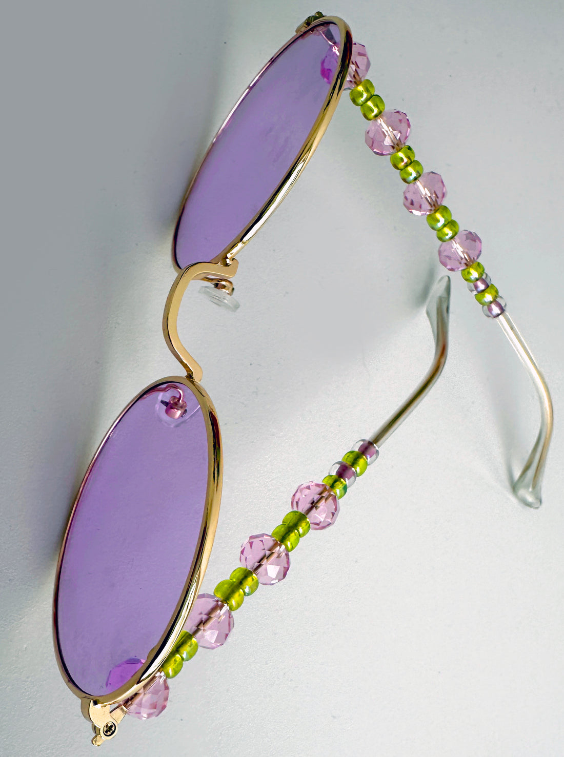 Statement beaded women's sunglasses - round purple lenses, golden metal frame decorated with pink & green beads - a classy fashion accessory